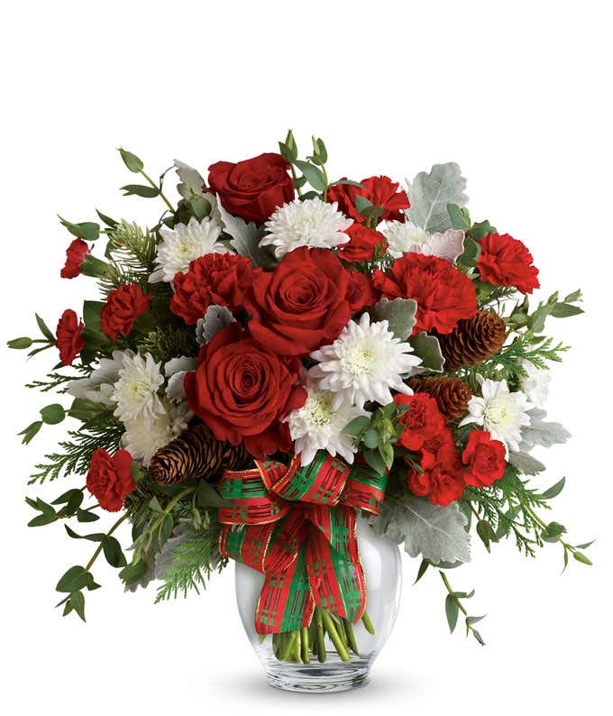 Red roses, red carnations and white mums in a holiday bouquet