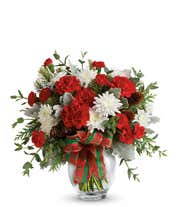 Red roses, red carnations and white mums in a holiday bouquet