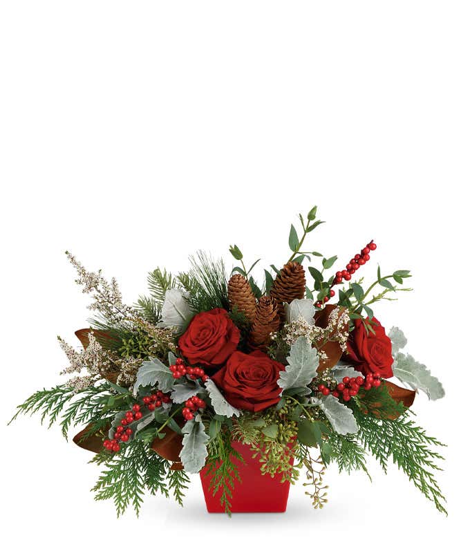 Red roses, pine cones and red hypericum berries christmas bouquet