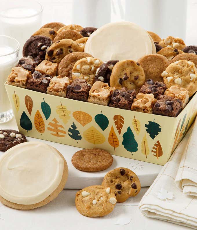 Gift box with autumn leaf illustrations. Inside are assorted flavors of cookies and brownies