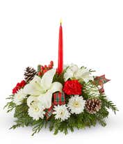 Red roses, white lilies, hypericum berries and red candle centerpieces.