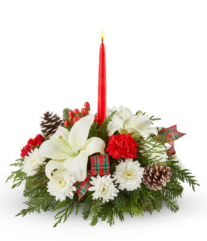 Red roses, white lilies, hypericum berries and red candle centerpieces.