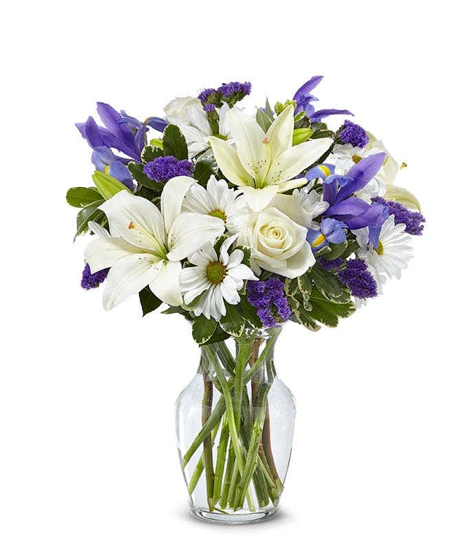 Sympathy bouquet with white roses and blue iris