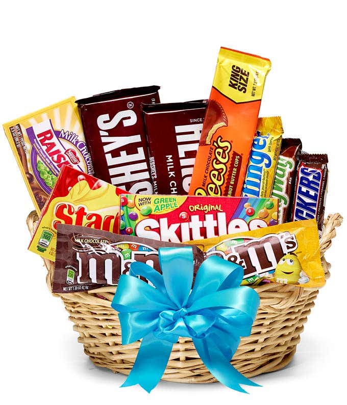 Gift Basket with a variety of candy and chocolate bars with a blue ribbon