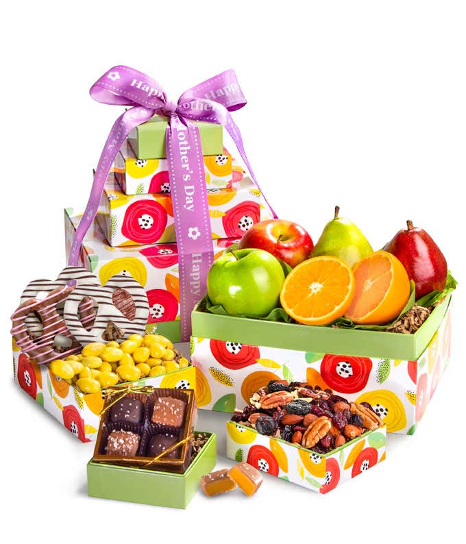 Mother's Day Gift Basket: Green D'Anjou Pear, Red D'Anjou Pear, Navel Orange, Braeburn Apple, Granny Smith Apple, Gourmet Brownies, Cherry Berry Trail Mix, Lemon Crme Almonds, Milk & Dark Chocolate Sea Salt Caramels. Adorned with a 