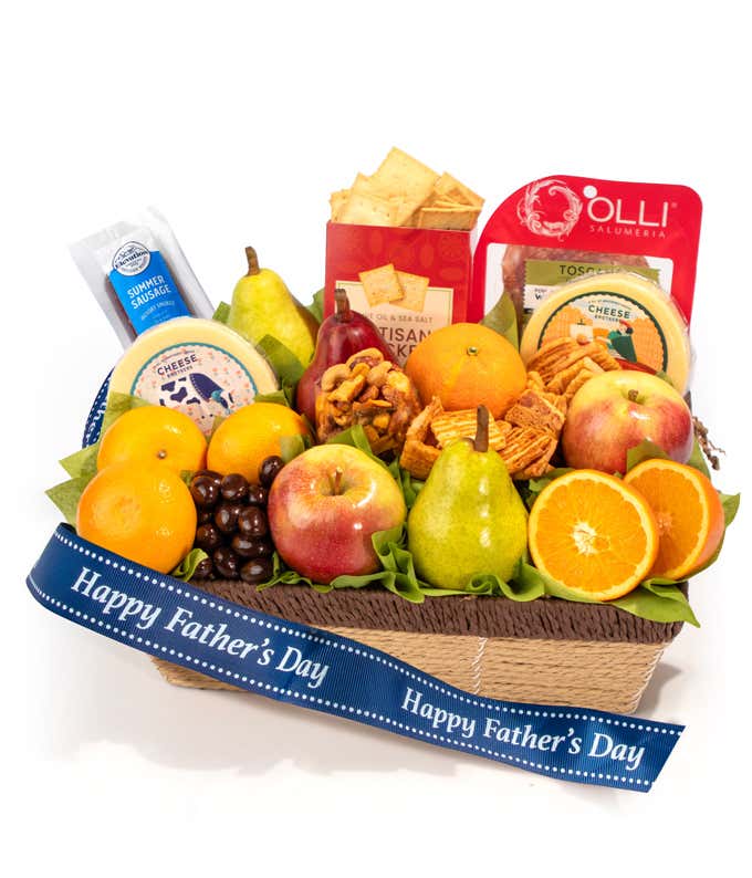 Father's Day gift basket filled with fresh fruit including apples, pears, oranges, and mandarins, alongside cheese, summer sausage, salami, crackers, and chocolate-covered treats, decorated with a navy Happy Fathers Day ribbon.