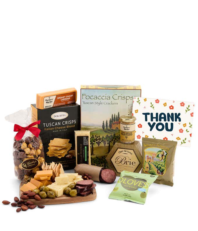 A gourmet charcuterie gift set featuring Tuscan crisps, focaccia crackers, 3 cheeses, olives, mustard, smoked almonds, chocolate-covered popcorn, sausage and finished with a Thank You card to show your appreciation.