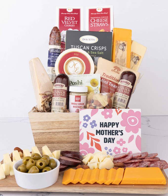 Wooden charcuterie gift crate filled with artisan summer sausage, cheeses, brie, Tuscan crisps, olives, mustard, and savory snacks, displayed with a Happy Mother’s Day card and arranged with sliced meats and cheeses.