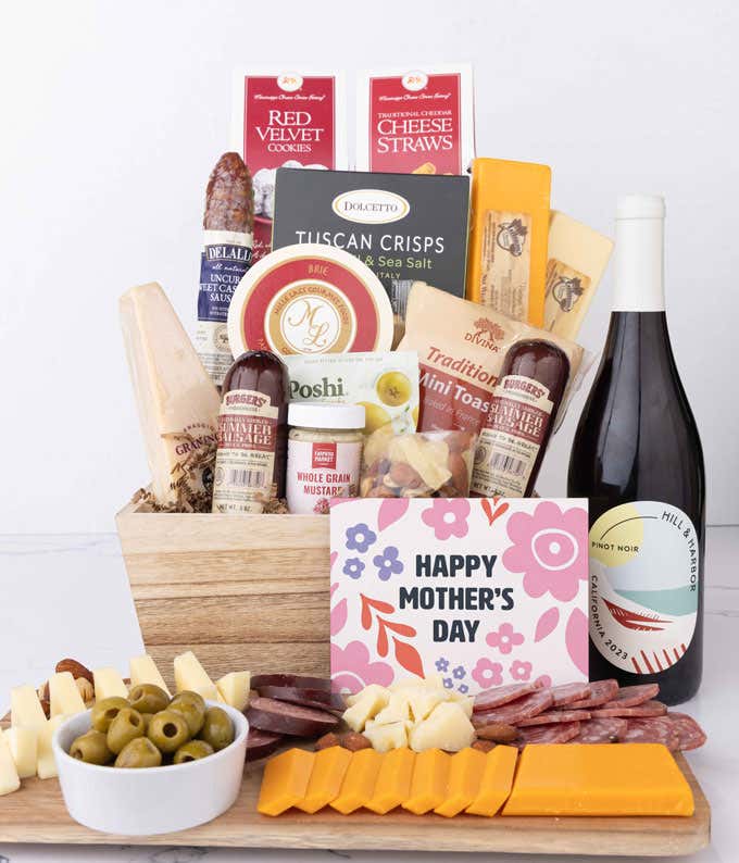 Mother’s Day charcuterie crate with Hill & Harbor Pinot Noir, artisan sausage, cheeses, olives, Tuscan crisps, mustard, cookies, and savory snacks displayed with sliced meats, cheeses, and a floral Mother’s Day card.