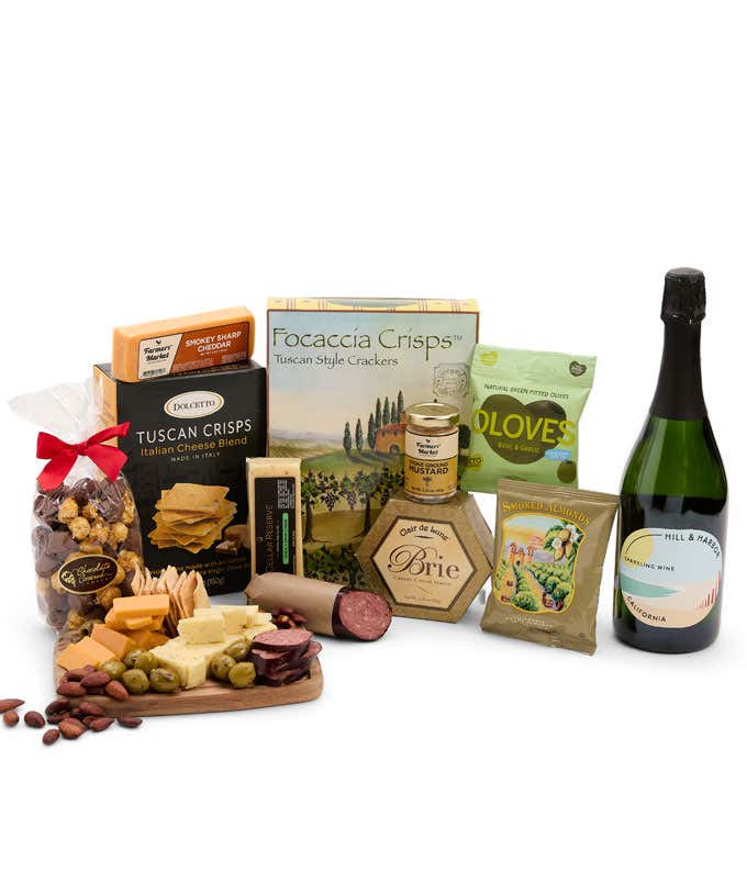 An abundant gift box filled with California Sparkling Wine, assorted crackers, three cheeses, summer sausage, and snacks to make an amazing charcuterie spread. 