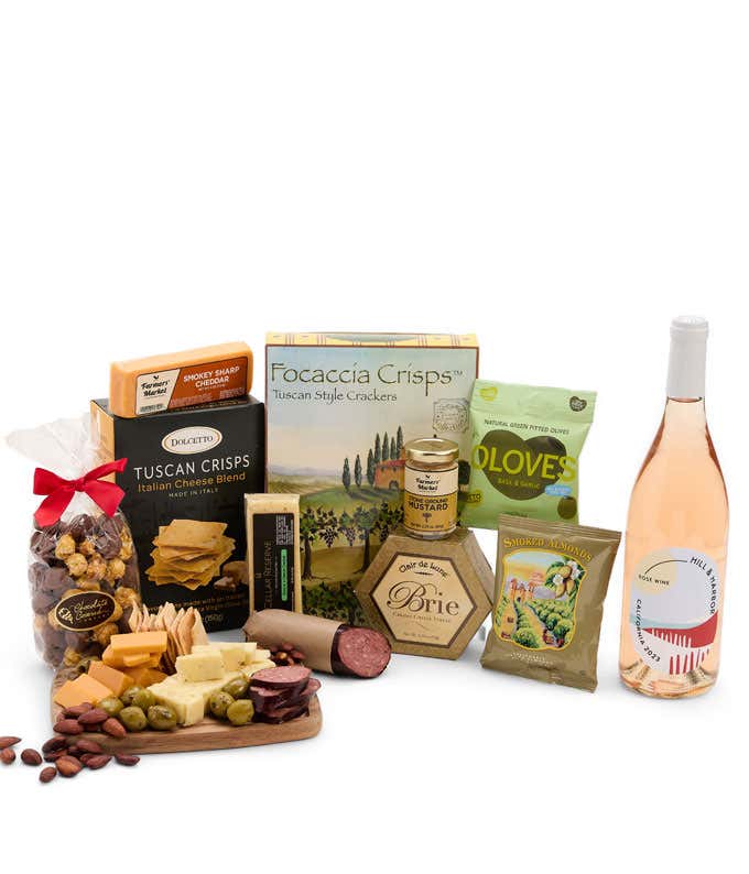 An abundant gift box filled with California Rosé Wine, assorted crackers, three cheeses, summer sausage, and snacks to make an amazing charcuterie spread. 