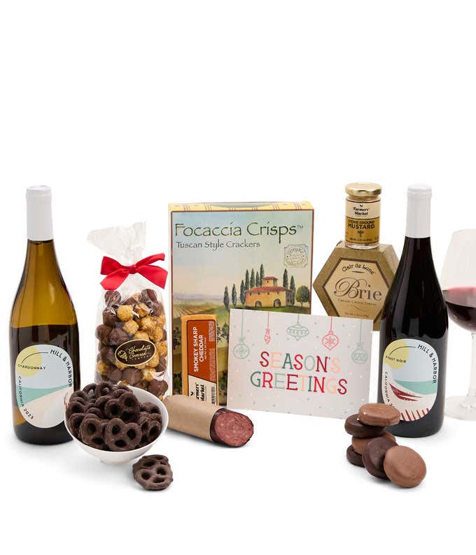 A gift set featuring two bottles of Hill & Harbor wine - white and red, focaccia crisps, 2 cheeses, mustard, summer sausage, caramel popcorn, chocolate pretzels, six chocolate-covered Oreos and a Season's Greetings card to complete the gourmet experience.