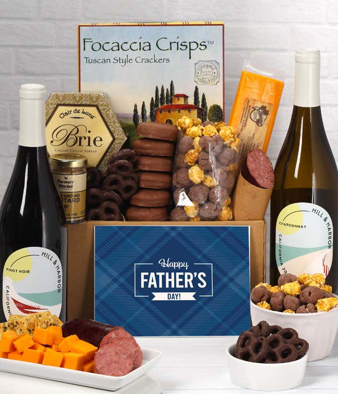 Two bottles of Hill & Harbor wine  with focaccia crisps, 2 cheeses, mustard, sausage, chocolate-covered pretzels, caramel popcorn, and chocolate-covered Oreos, complete with a 'Happy Father's Day' card.