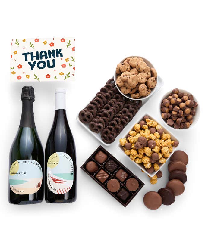 A gift set with 2 bottles of wine - red and sparkling, paired with chocolate pretzels, caramel popcorn, mini cookies, chocolate peanut butter buckeyes, six chocolate-covered Oreos, assorted chocolates, and an appreciative Thank You card.