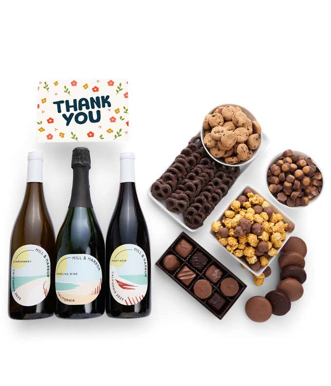 A gift set with 3 bottles of wine - red, white and sparkling, paired with chocolate pretzels, caramel popcorn, mini cookies, chocolate peanut butter buckeyes, six chocolate-covered Oreos, assorted chocolates, and an appreciative Thank You card.