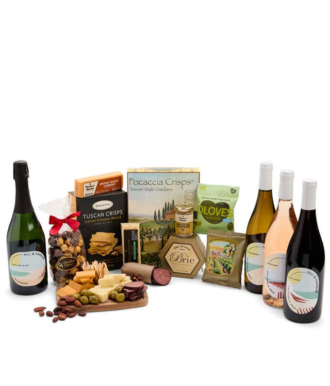 A wine and cheese gift set featuring 4 bottles of Hill & Harbor - Sparkling wine, Ros wine, Chardonnay, and Pinot Noir. Includes a variety of cheeses, crackers, olives, smoked almonds, summer sausage, and condiments.