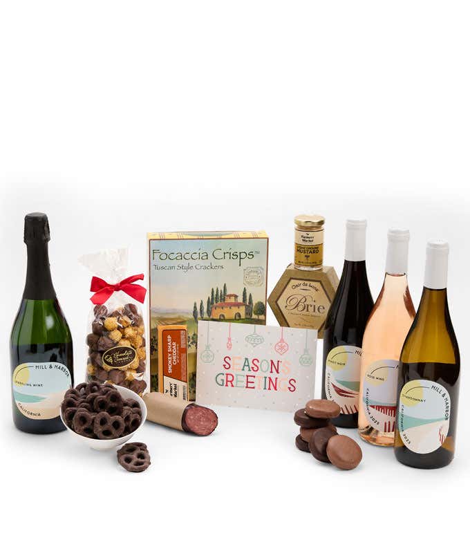 A gift set featuring 4 California wines - red, white, and sparkling, focaccia crisps, two cheeses, mustard, summer sausage, caramel popcorn, chocolate pretzels, six chocolate-covered Oreos and a Season's Greetings card.