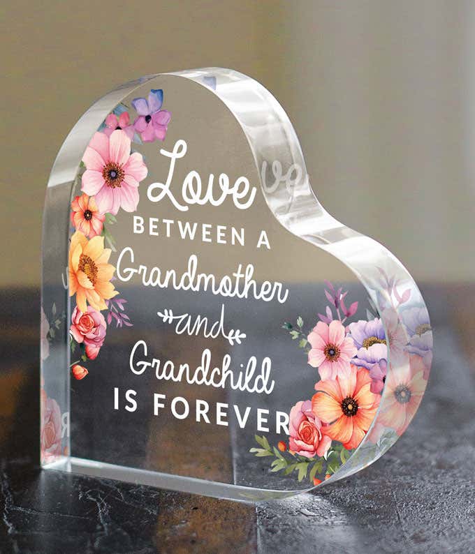 Image: An acrylic heart with a Floral Design and the message 