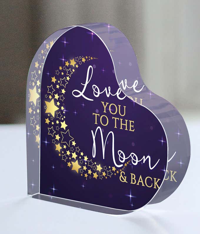 Purple acrylic heart with gold and white text saying Love you to the Moon and Back, with a crescent moon made out of hearts