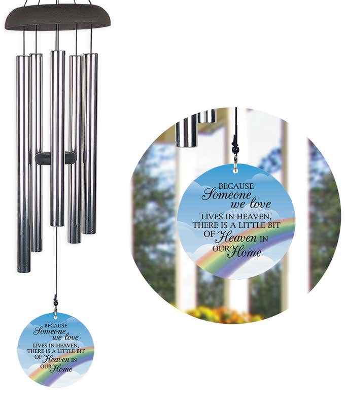 Windchime with blue sail with white clouds, a rainbow, and the quote 