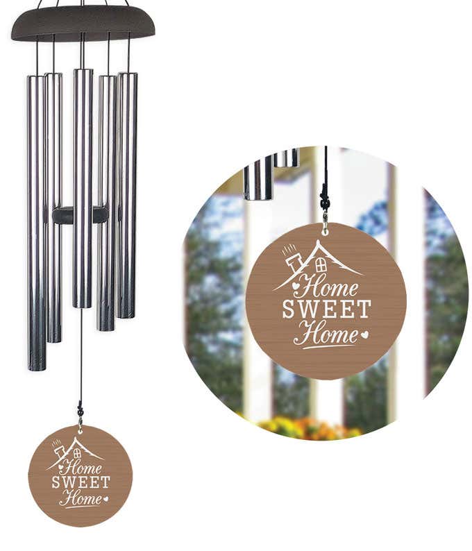 A wind chime with a light brown wood grain design with a roof ad chimney illustration saying 