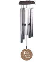 Alternative image 1 for A wind chime with a light brown wood grain design with a roof ad chimney illustration saying 