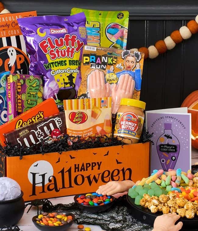Gift Box with spider web cotton candy, caramel popcorn, haribo goldbears, halloween junior mints, plain m&amp;m's, sugar babies, ghost dots, kettle corn, gummy worms, black &amp; white cookies, and candy corn
