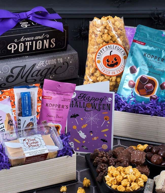 Gift Boxes consisting of 3 fake books. One is filled with Candy Corn, another with Caramel popcorn, and another with Mars &amp; Skittles candy mixes