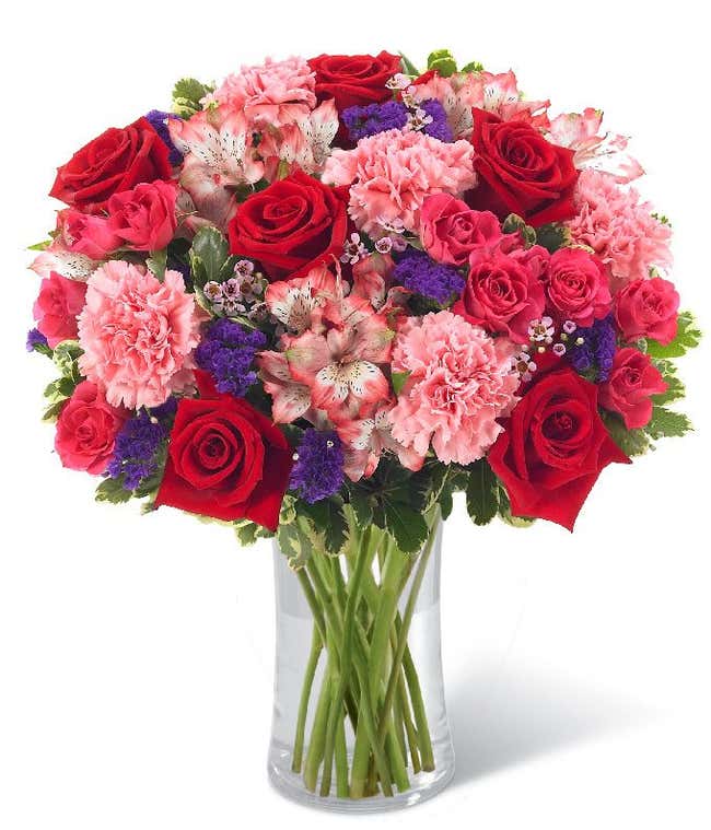 Red roses delivered with pink carnations and alstroemeria