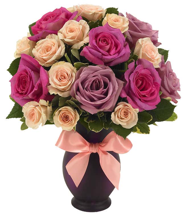 Purple roses and pink roses deliveried in a purple vase