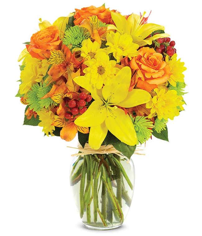 yellow lilies, orange roses and green poms