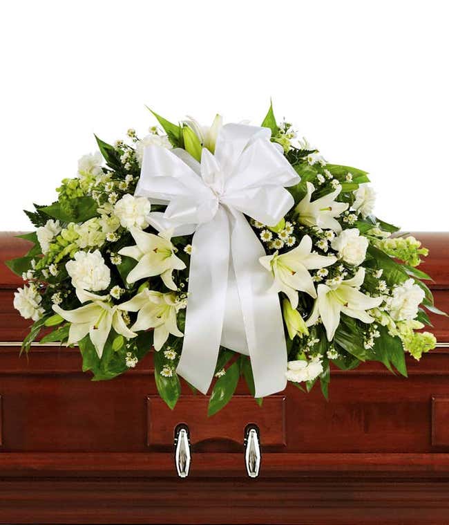 White Lily and White Carnations arranged as a casket spray