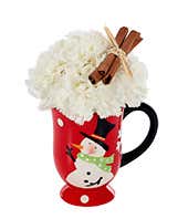 White carnations in snowman mug