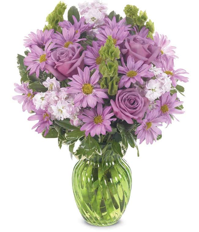 Arrangement with purple roses, daisies and bells of Ireland