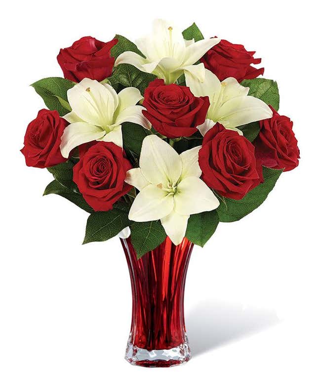 Red roses, white lilies in a red vase