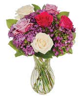 Purple roses, white roses and hot pink rose arrangement 