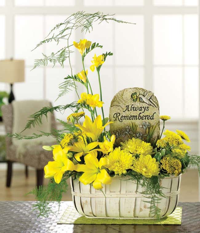 Sympathy bouquet with yellow lilies and mums 