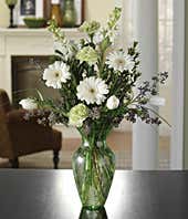 Flower arrangement with white tulips, white daisies and green carnations
