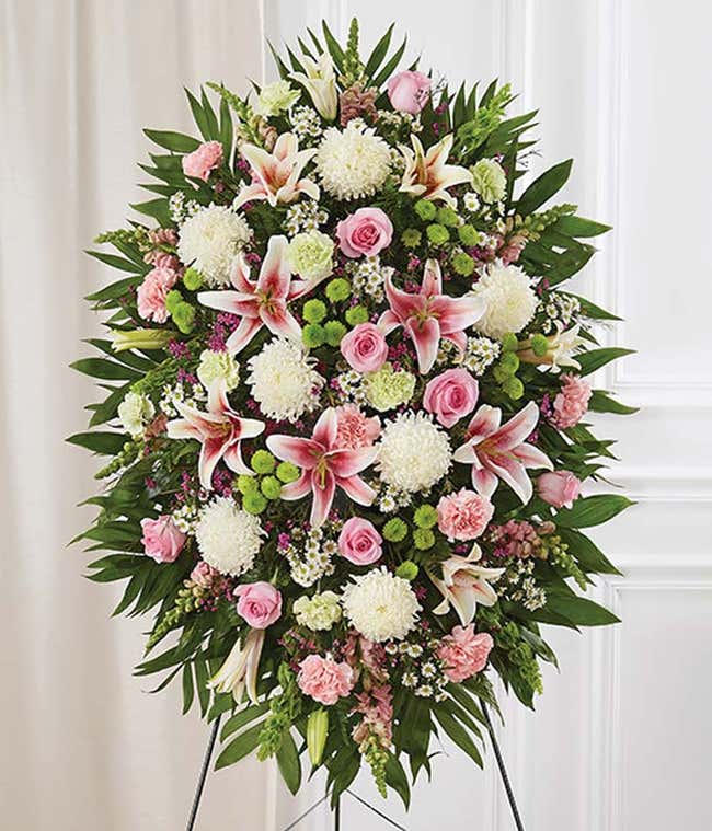 Floral pastel sympathy standing spray with roses and lilies