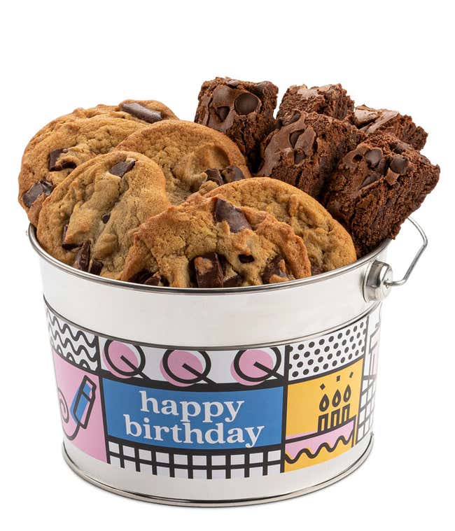 A Happy Birthday bucket filled with David's cookies and brownies. The bucket features a colorful design with birthday-themed decorations. The assortment includes chocolate chip cookies and chocolate brownies.