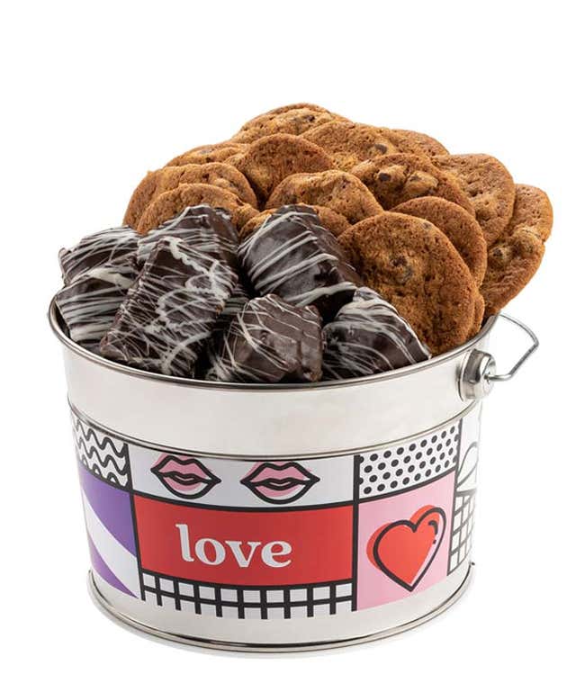 A decorative tin with a pop art design featuring bold patterns, lips, a heart, and the word 