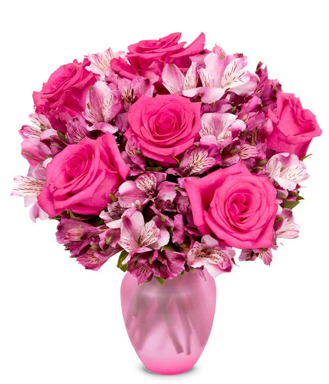 A bouquet featuring pink roses and pink alstroemeria, with an optional glass vase.