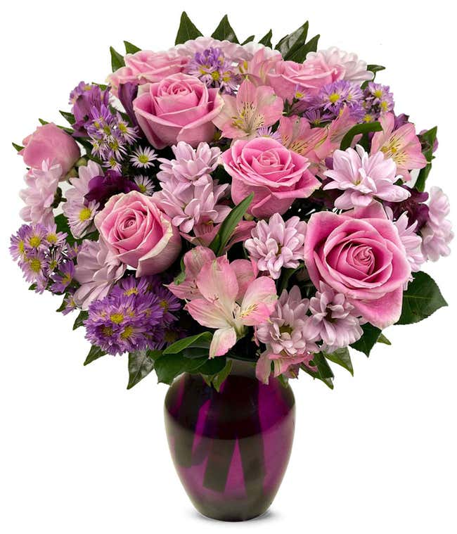 A bouquet featuring pink roses, purple daisies, pink alstroemeria, purple alstroemeria, and purple Monte Casino, with an optional vase.