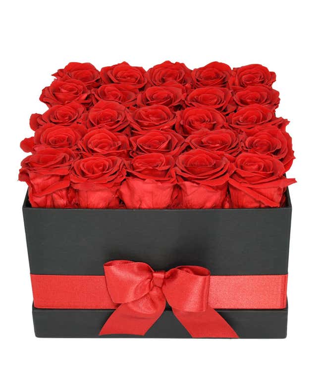 25 preserved red roses arranged into a black hat box with a red ribbon.