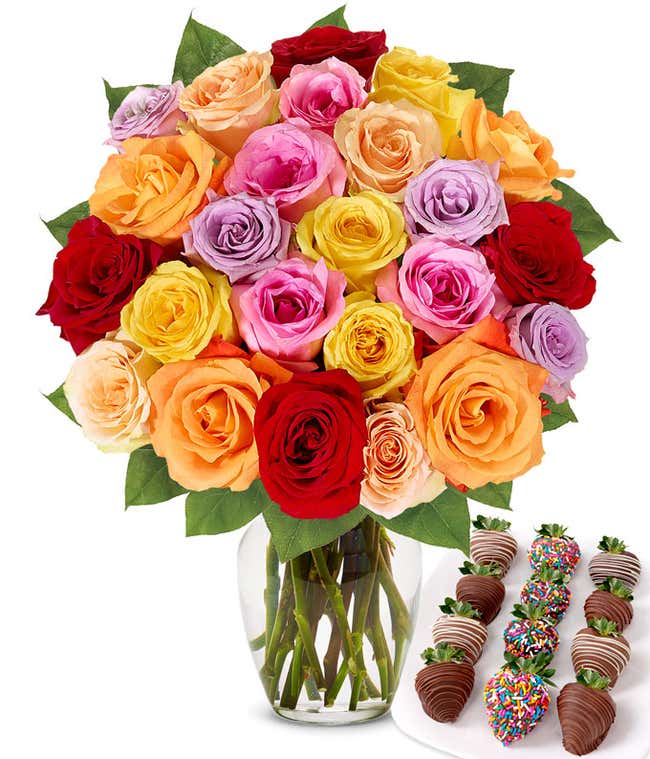 Two dozen rainbow roses with one dozen chocolate covered strawberries decorated with rainbow sprinkles.