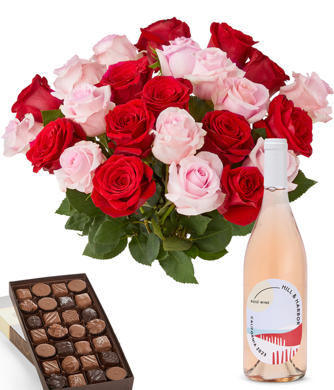 Partial image of A bouquet of 24 red and pink roses arranged in a glass vase is displayed beside a bottle of Hill &amp; Harbor Ros&eacute; and a 1 pound box of assorted chocolates. without vase.
