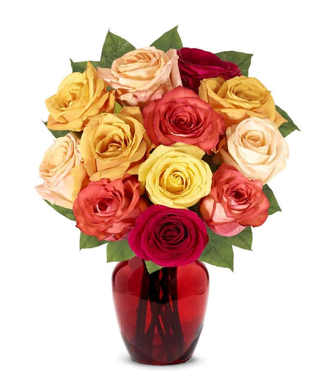 A stunning floral arrangement featuring orange roses, red roses, and yellow roses, optionally presented in a glass vase.