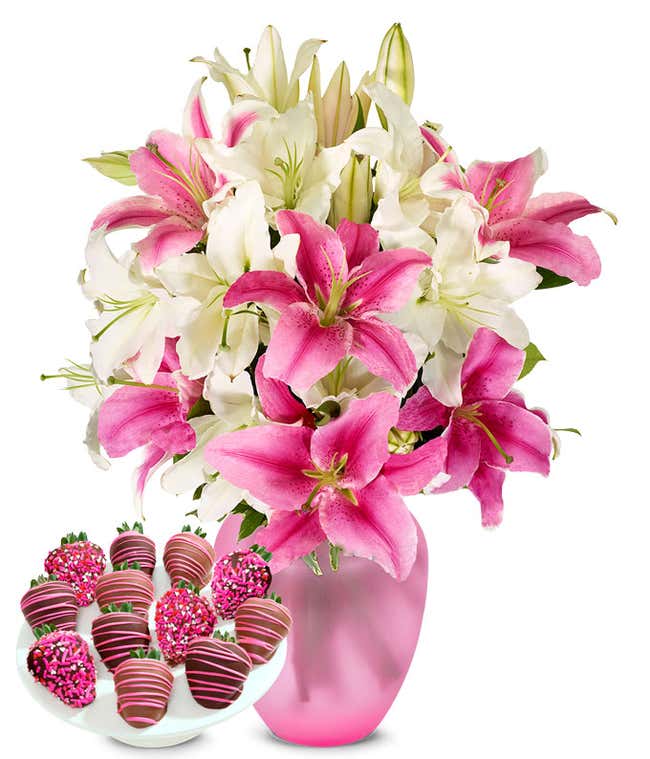 A bouquet featuring pink lilies and white lilies, with an optional glass vase and Chocolate Covered Strawberries