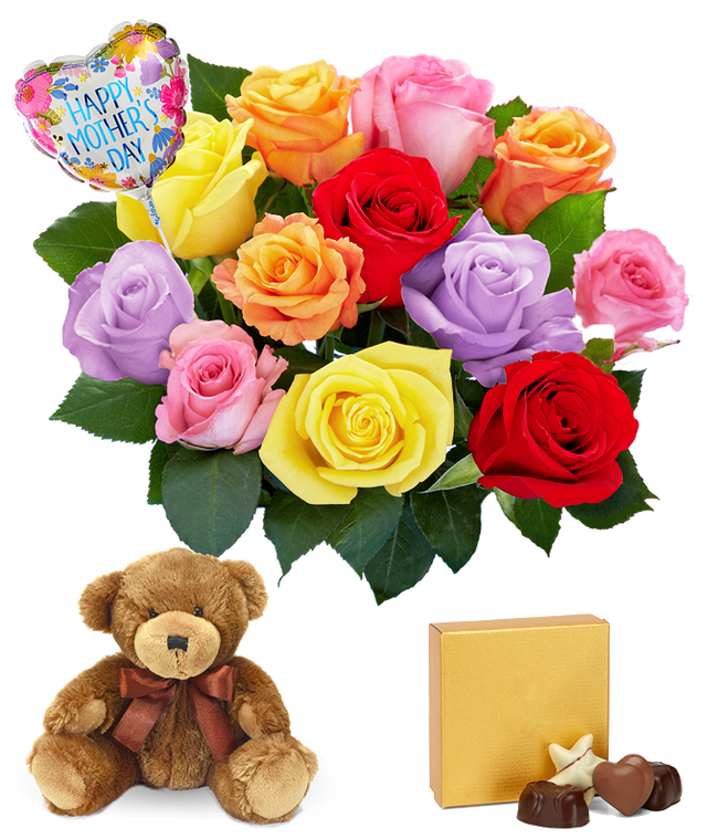 Partial image of One Dozen Rainbow Roses in a clear glass vase with a box of chocolates, a teddy bear, and a heart shaped Happy Mother's Day mylar balloon without vase.
