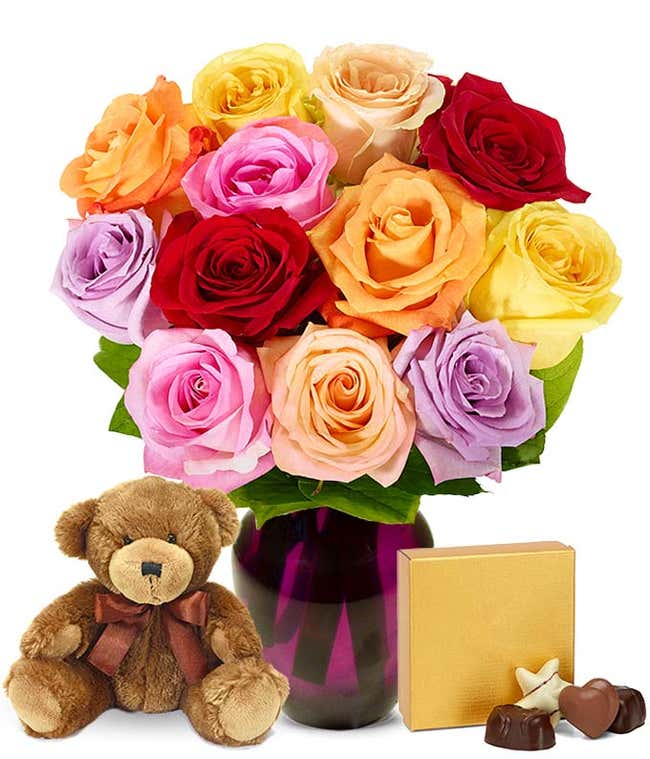 Mixed roses, teddy bear and chocolates